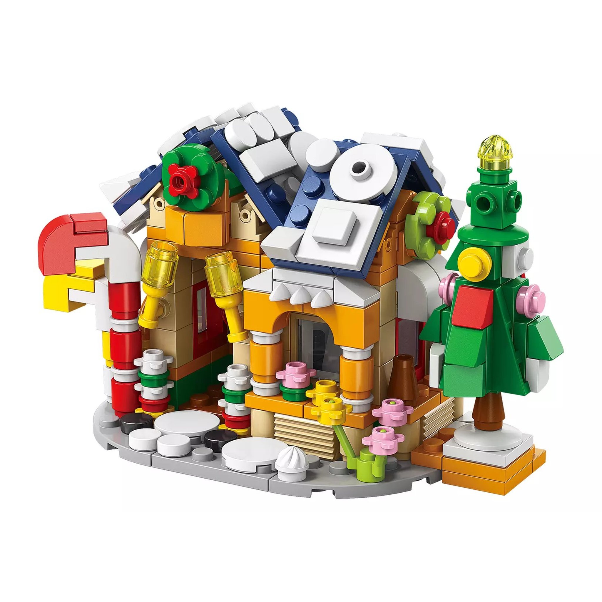 Snowy little house with a fir tree, built from the advent calendar bricks