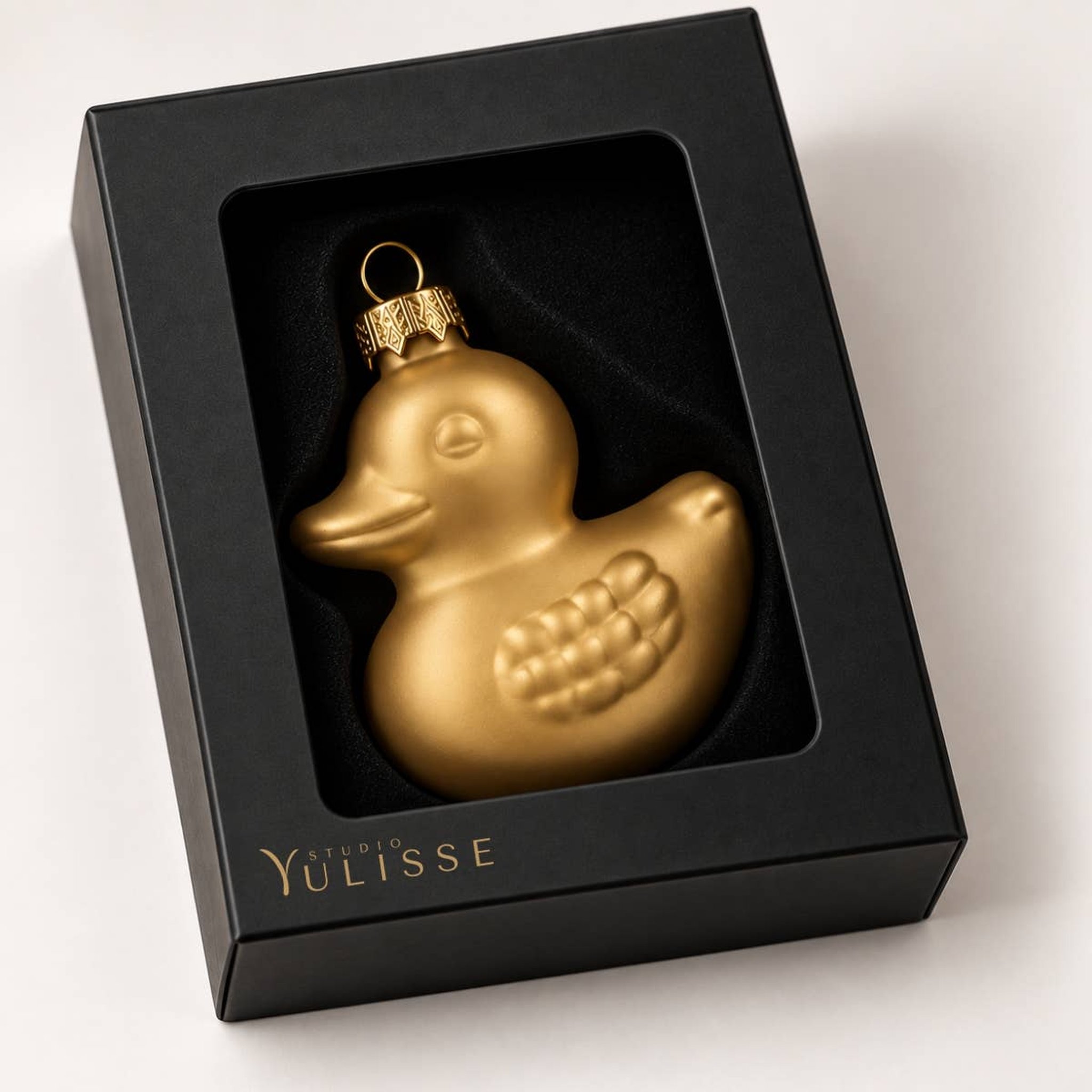 Canard doré dans la boîte cadeau noire Studio Yulisse avec fenêtre