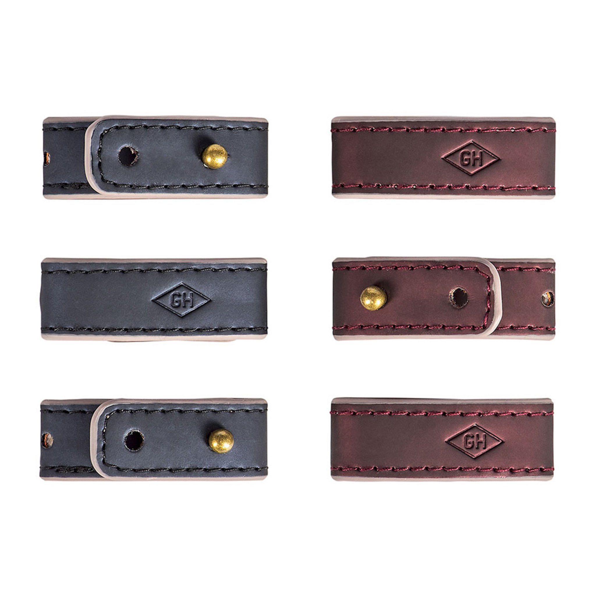 Six attaches du Set Cable Tidies déballées, bleu foncé et bordeaux, avec rivets en laiton