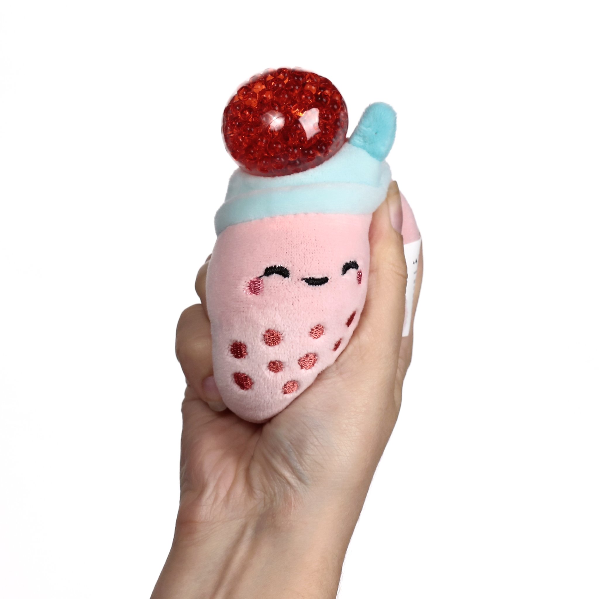 Rosa Bubble-Tea-Plueschstressball in der Hand