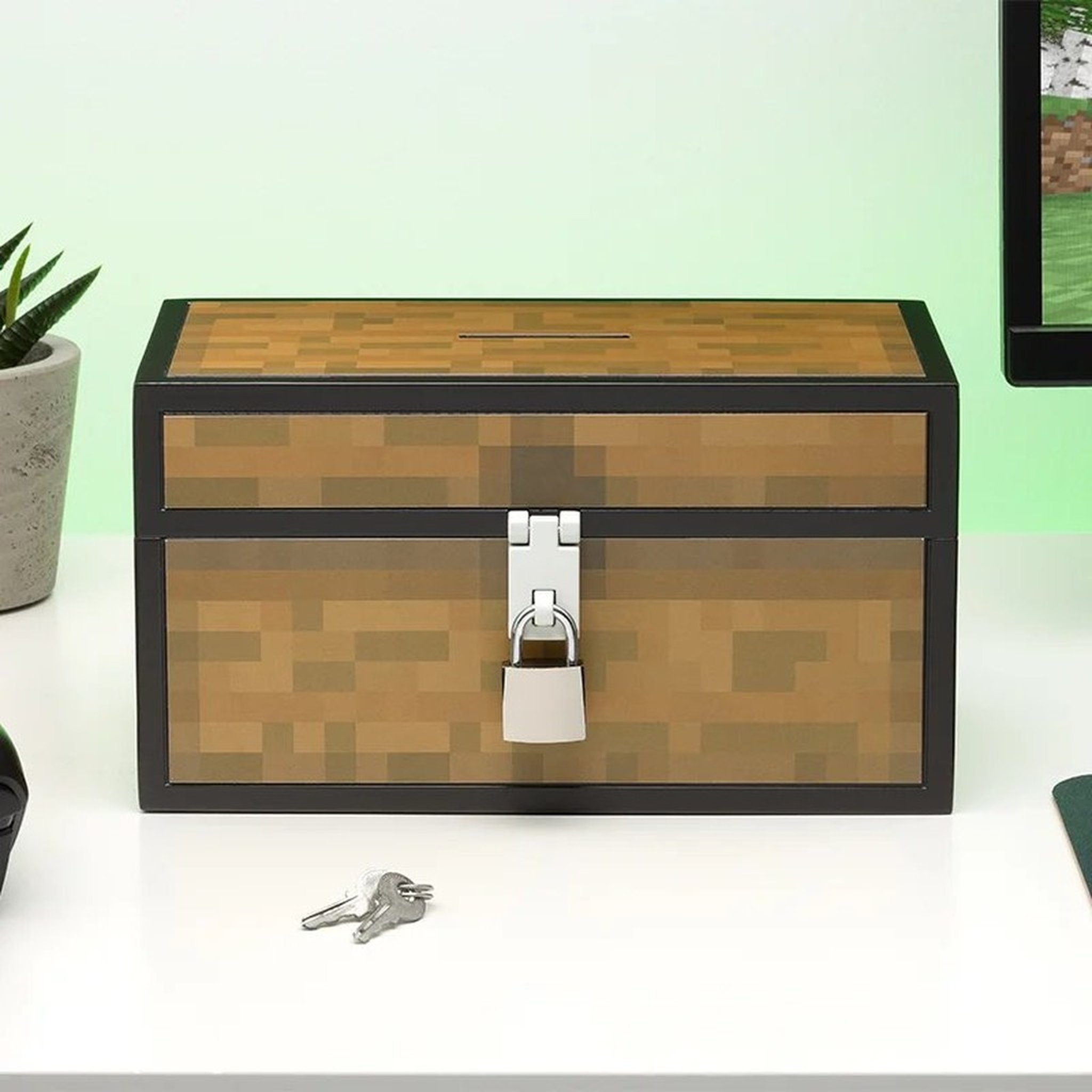 Minecraft chest money box with keys on a desk
