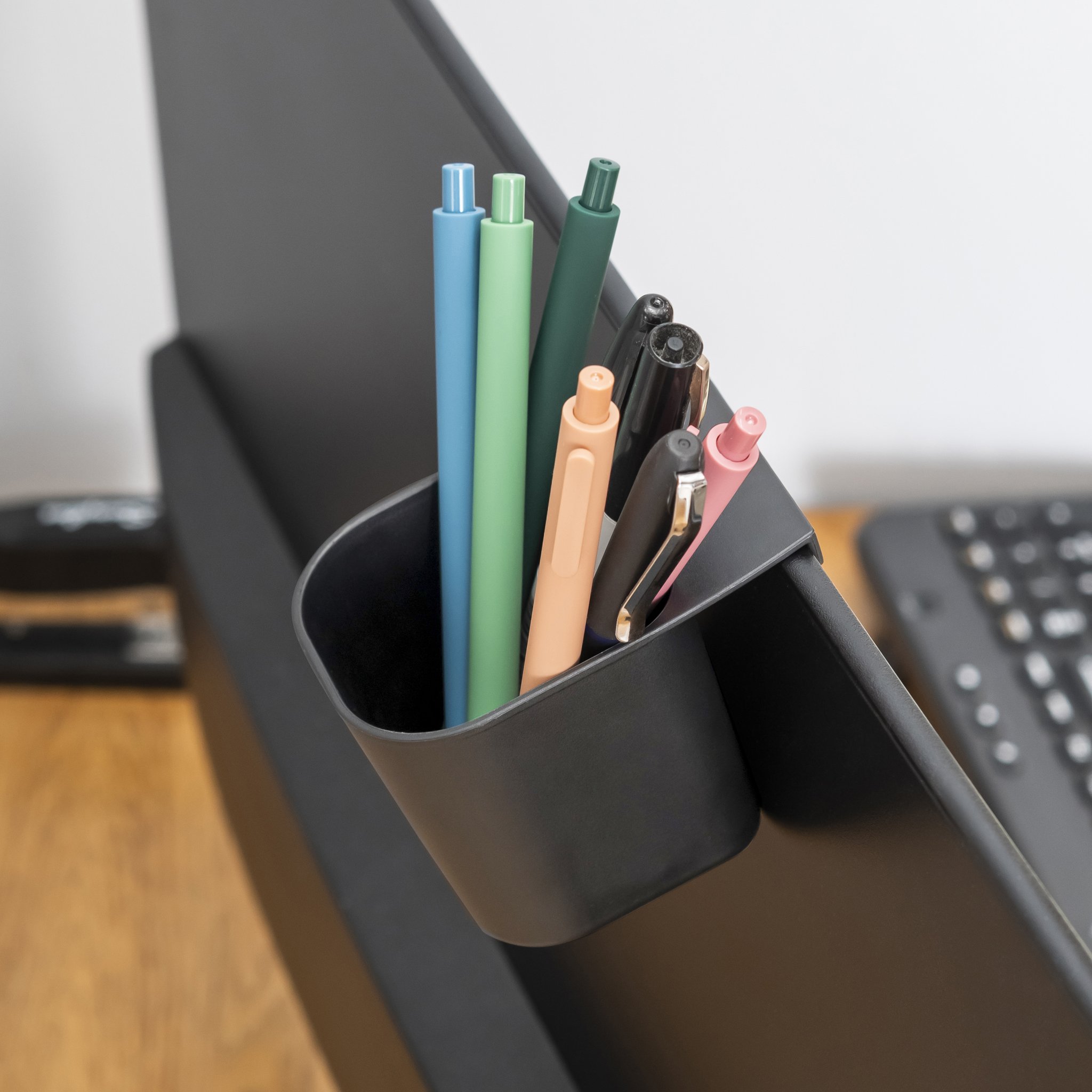 Storage pot hooked on the monitor edge with pens