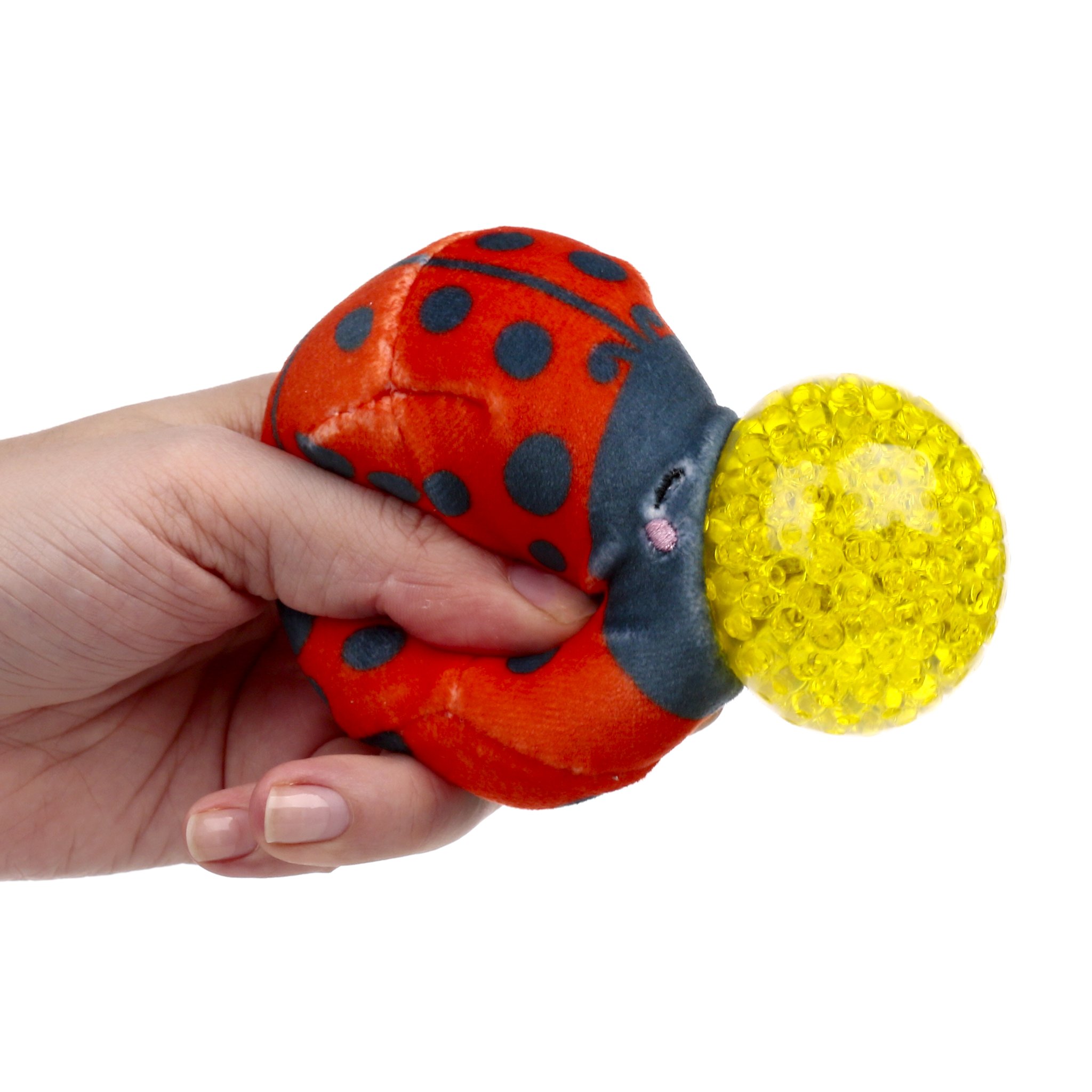 Marienkaefer-Plueschstressball in der Hand, Gelkugel tritt hervor