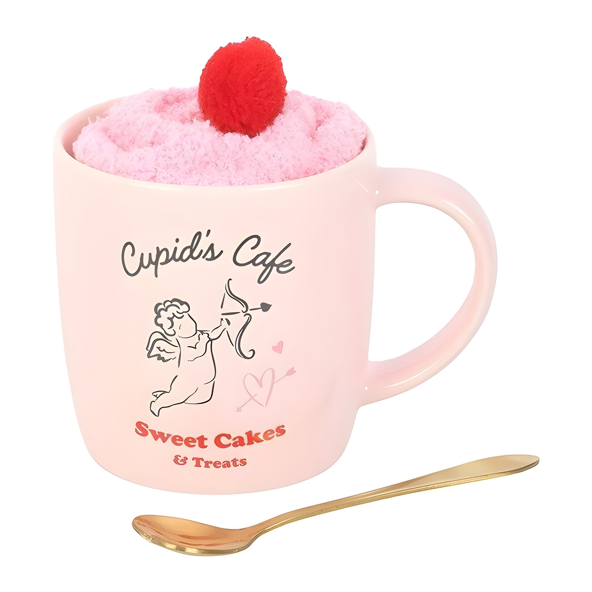Gros plan de la tasse au motif Cupidon et de la cuillère cœur