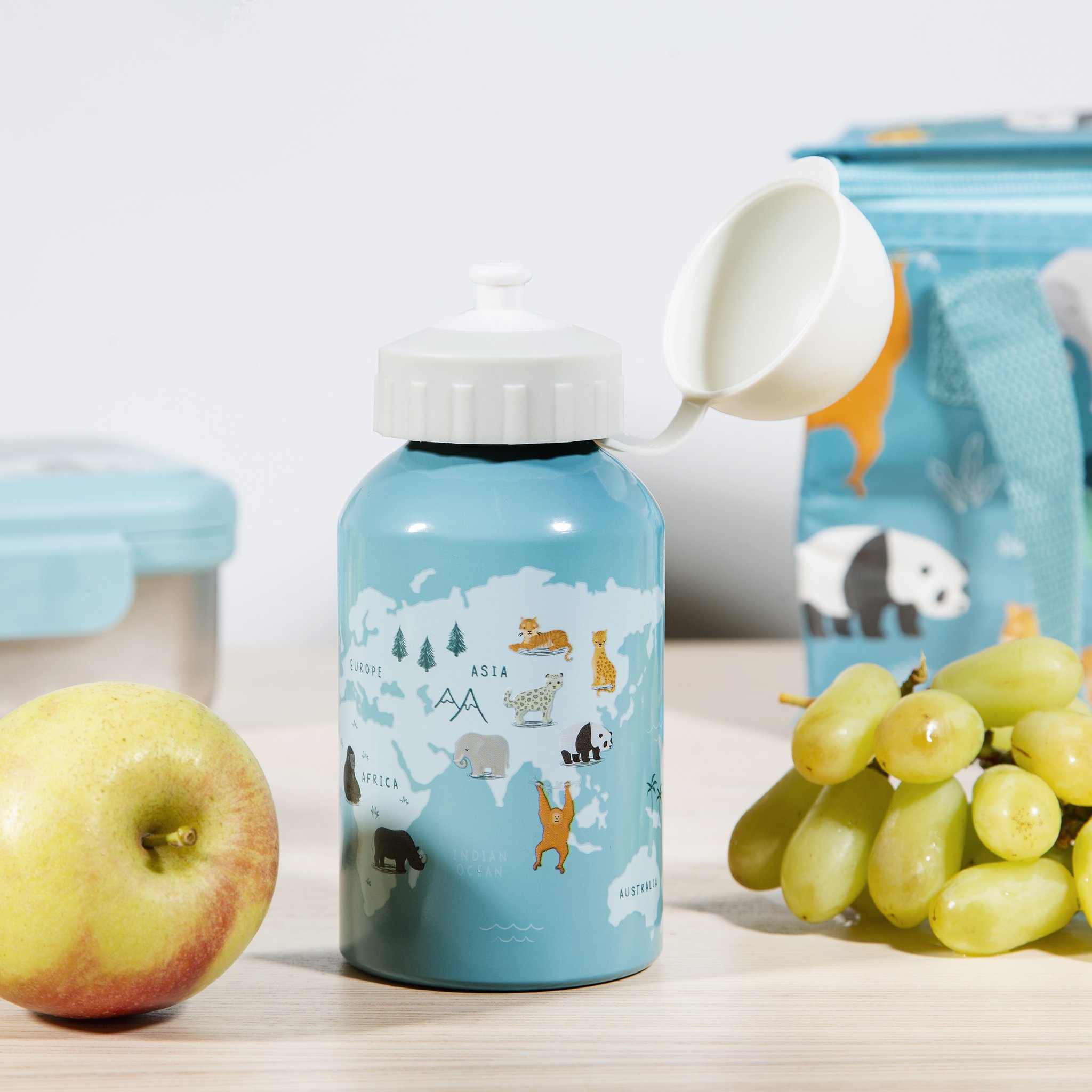 Endangered animals kids water bottle by Sass & Belle with apple and grapes next to the lunch bag