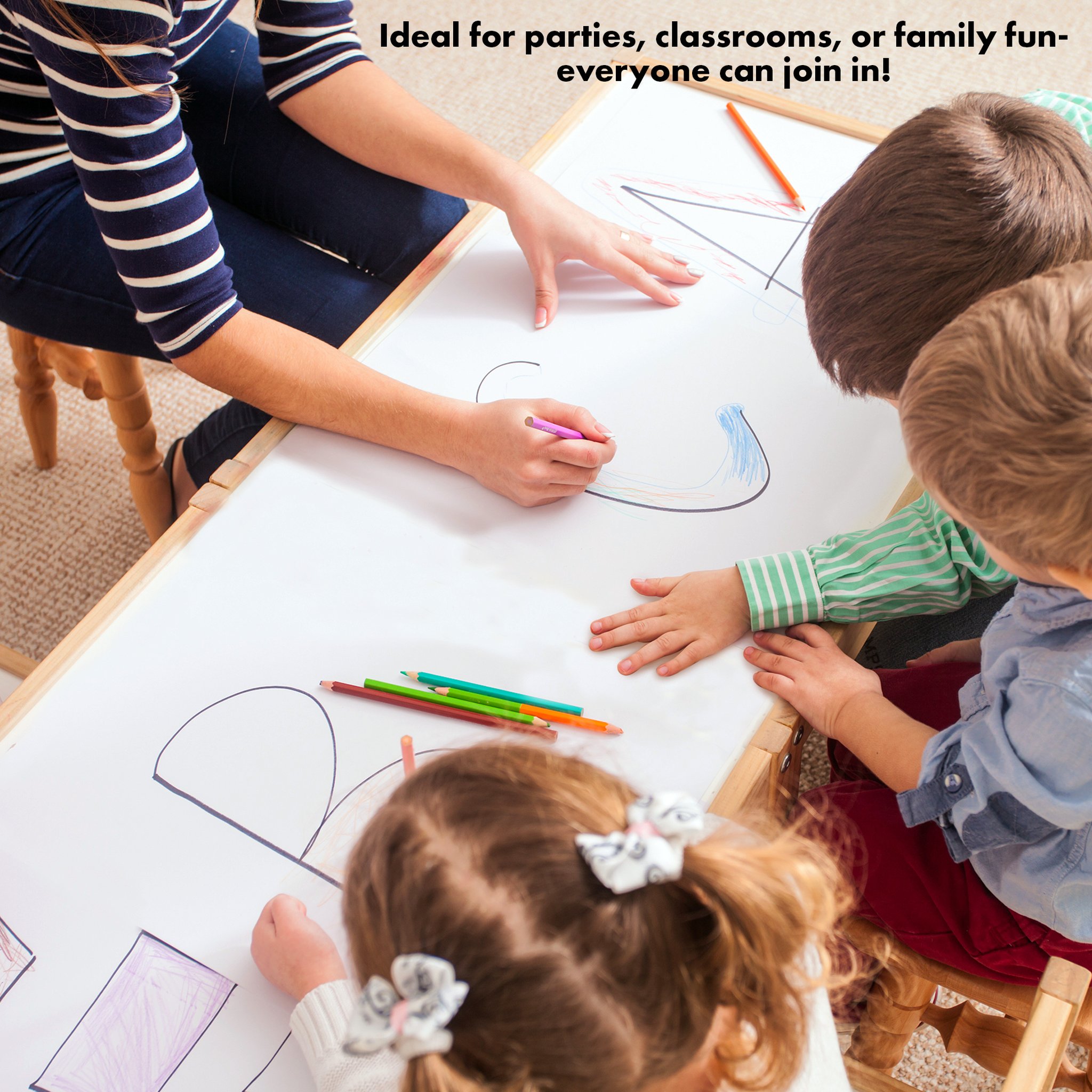 Children drawing together on the abeec paper roll