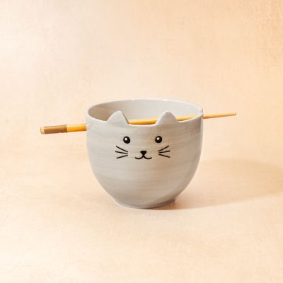 Cat noodle bowl by Sass & Belle with bamboo chopsticks on a beige background